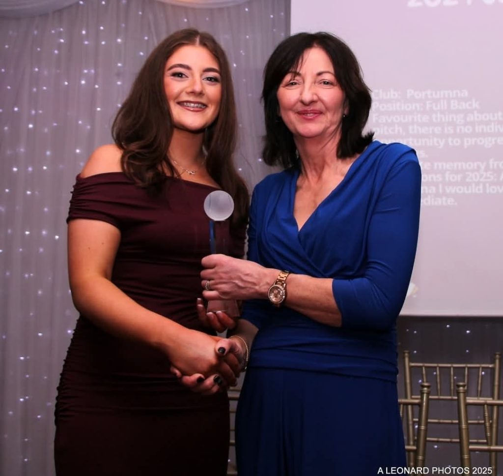 Treacy Scott receives her award from Imelda Hobbins, a former great Galway Camogie Player.