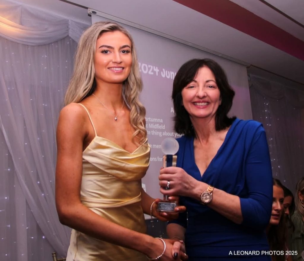 Ava Bloomer receives her award from Imelda Hobbins, a former great Galway Camogie Player.