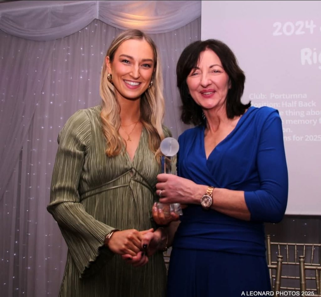 Alannah Kelly receives her award from Imelda Hobbins, a former great Galway Camogie Player.