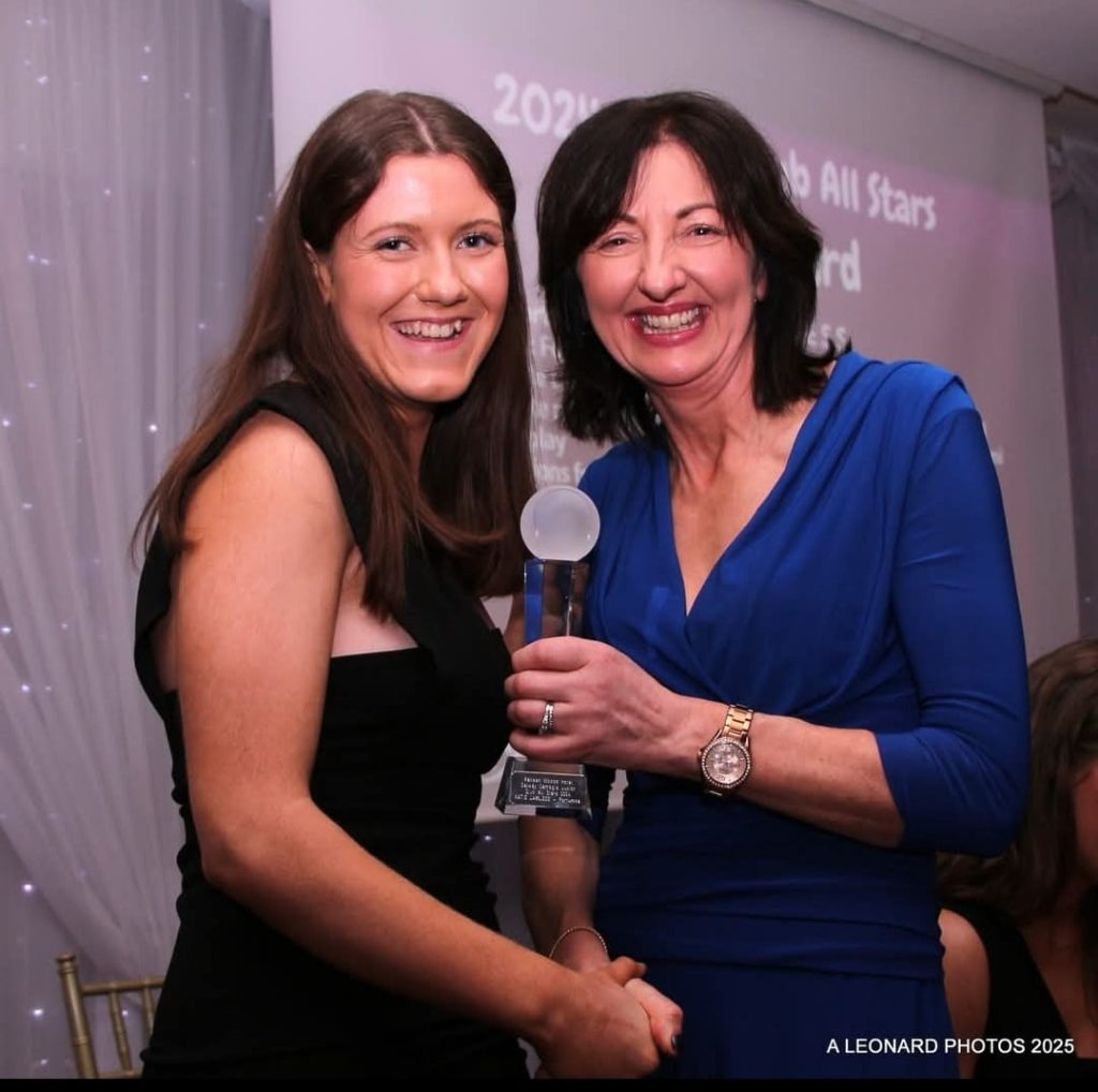 Katie Lawless receives her award from Imelda Hobbins, a former great Galway Camogie Player.