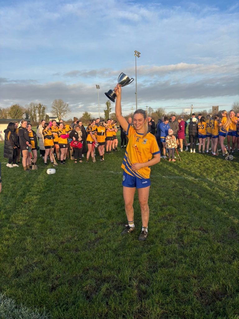 Team captain Alannah Kelly holds the Connacht trophy.